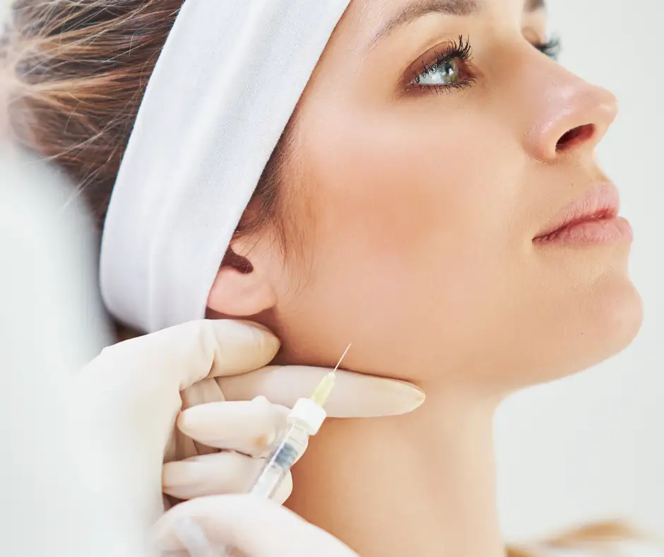 woman getting jawline injection Jawline Contouring with JUVÉDERM volux